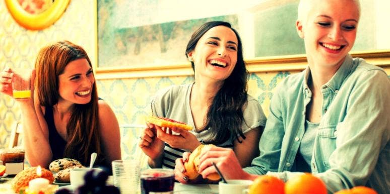 8 Reasons Weight Fluctuation Is So Common In Fall & Winter three women eating together and laughing