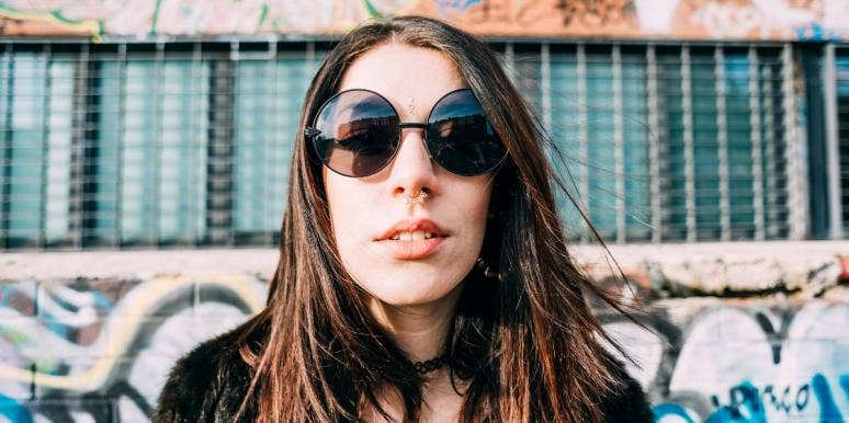 What Is An Alt Girl On TikTok? woman with septum piercing wearing sunglasses