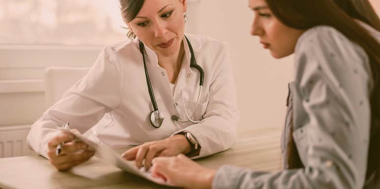 What Cervical Dysplasia Taught Me About The Importance Of Routine Pap Smears woman in a appointment with doctor