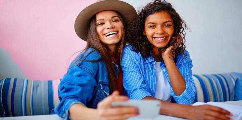What Does Bae Mean? Slang Meaning & How To Use It two friends smiling for a selfie