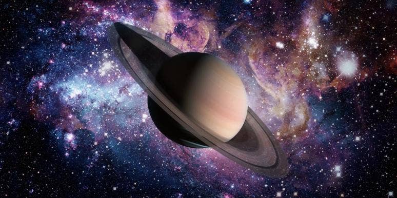 What Does Your Saturn Sign Mean In Astrology? planet saturn in front of galaxy