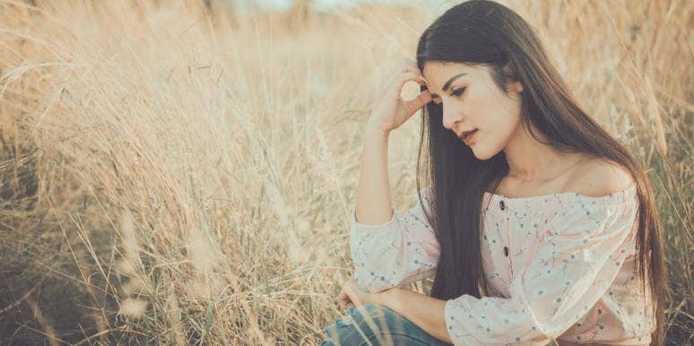 What I Realized When He Told Me He's Not 'In Love' With Me sad woman thinking