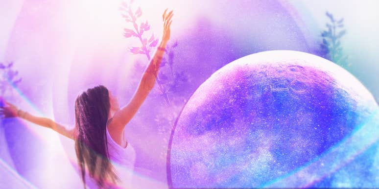 What Is A Starseed & 25 Signs Your Soul Is From Another Planet woman reaching in front of a planet