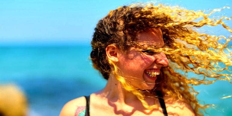 What Is An Ambivert? Signs You're An Ambivert ambivert woman smiling but looking away