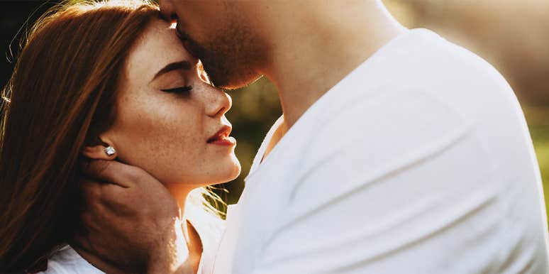 10 Signs You're In A Fantasy Relationship, Not A Real One man kissing woman's forehead