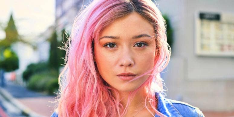 What Is Nagging? 9 Signs & How To Stop serious pretty woman with pink hair staring