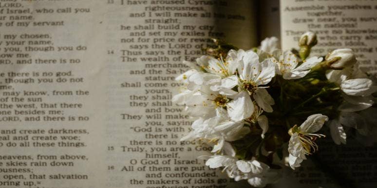 What Is The Meaning Of Good Friday? Definition, Traditions & History flowers in front of scripture