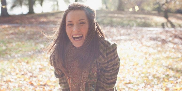 what is the throat chakra? woman laughing outside