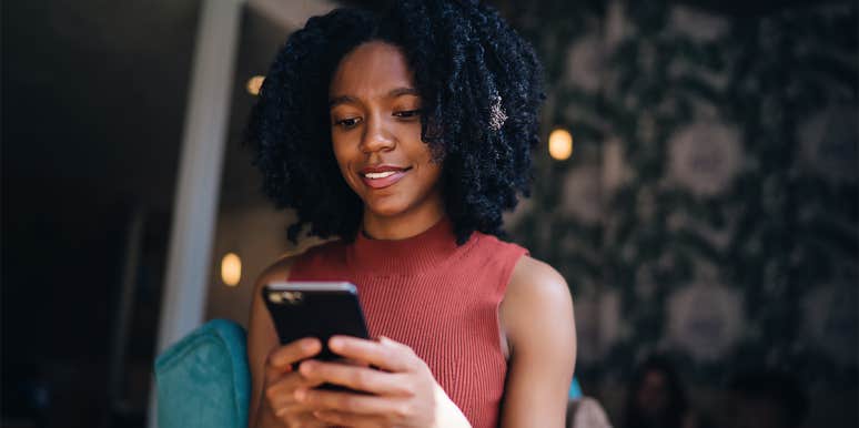 How To Spot "Wokefishing" — The Newest Dating Deception woman texting on phone