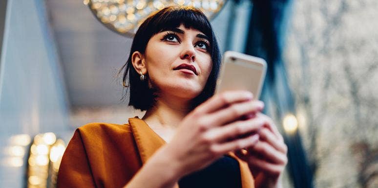 What You See First In This Image Will Tell You What Kind Of Communicator You Are woman looking at phone