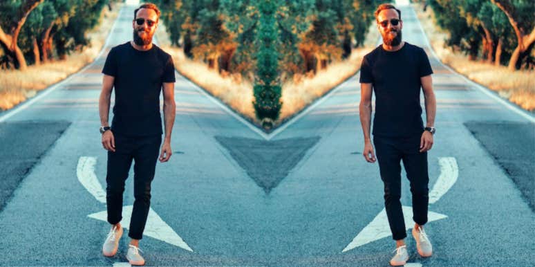 What Makes A Man Come Back After A Breakup mirrored image of smiling man walking on a street toward the camera
