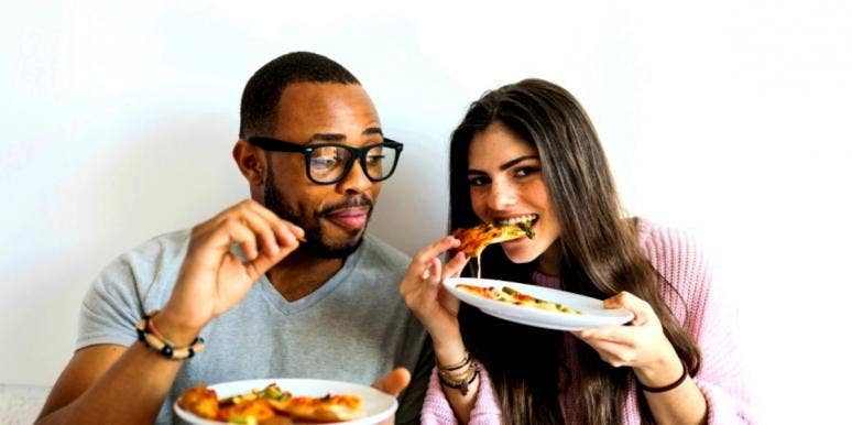 Free Pizza Motivates People More Than Money, Says Study couple eating free pizza