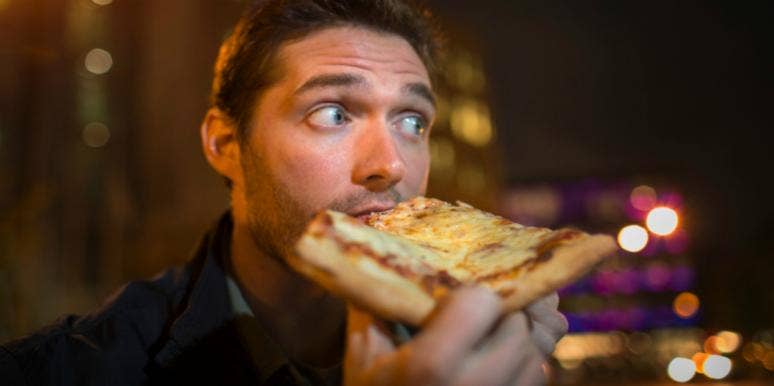 How To Tell Someone You're Not Interested After A First Date guy eating pizza being told a woman isn't interested after a first date