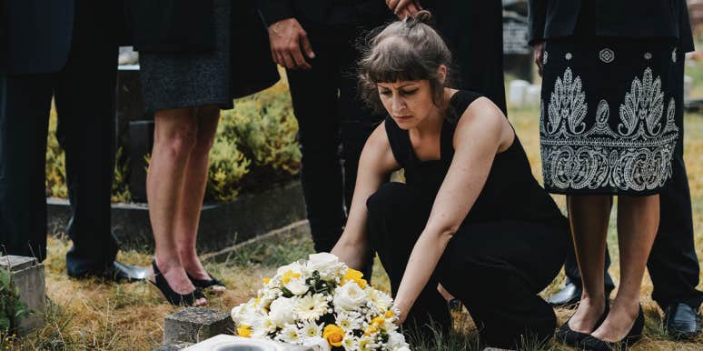 When There’s Death In A Dysfunctional Family woman putting flowers on grave