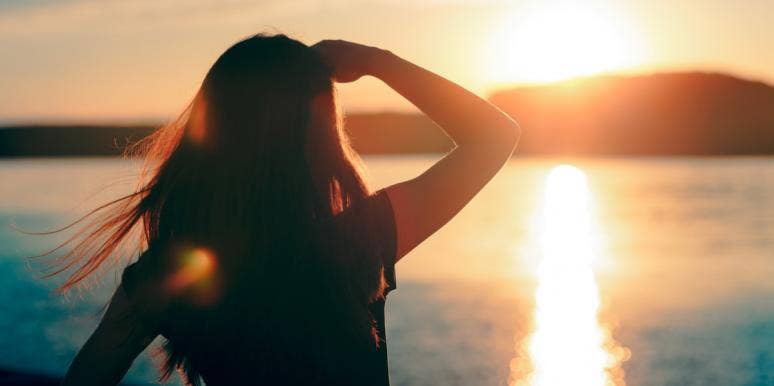 When Things Fall Apart, Something Better Replaces It woman looking at ocean sunset