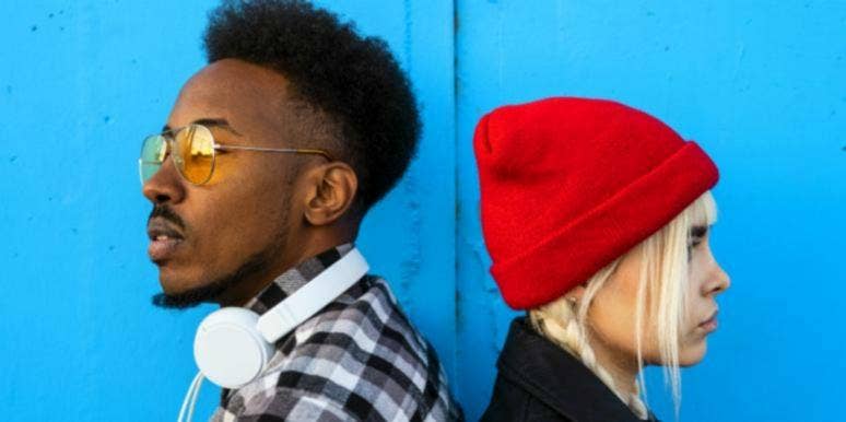 Zodiac Signs Who Are Mortal Enemies guy and girl facing away from each other blue background