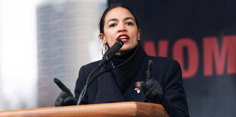 AOC’s Boyfriend: Who Is Riley Roberts? alexandria ocasio cortez speaking at podium