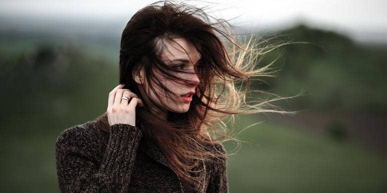 6 (Fixable!) Personality Traits That Men See As Red Flags woman alone