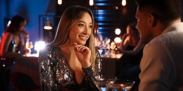 Being Single: 7 Ways To Answer 'Why Are You Single?' woman talking to man at bar