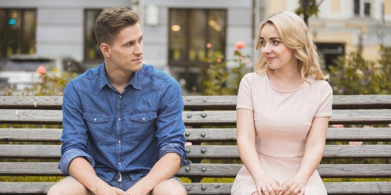 Why You Can’t Keep Waiting To Define Your Relationship man and woman sitting on bench