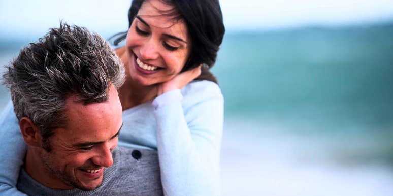 myths about why couples stop having sex couple playing around on the beach