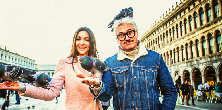 What Is Breadcrumbing? 12 Signs & Why Guys Do It man and woman feeding breadcrumbs to pigeons