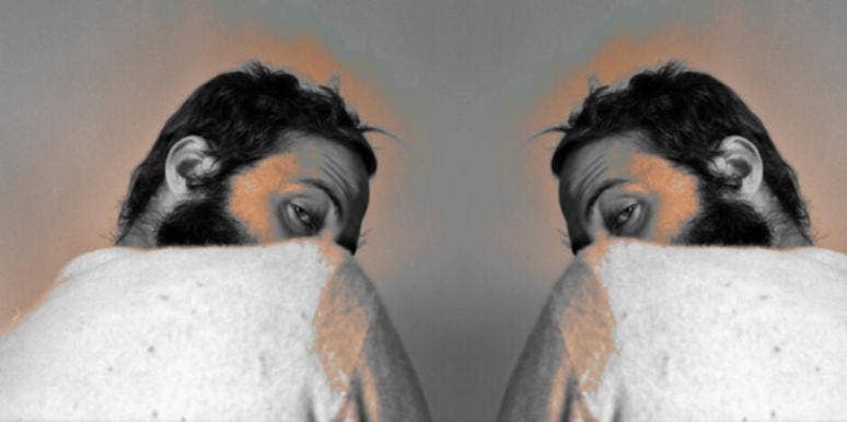 Why Men Become So Needy After A Breakup needy man after a breakup looking over his shoulder