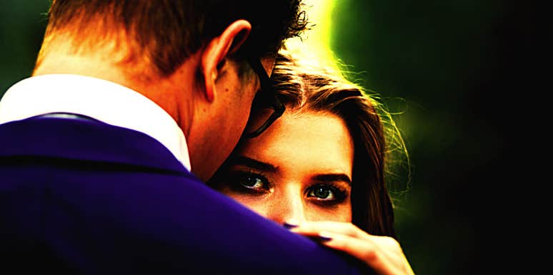 Why Emotionally Abusive Mind Games Make You Feel Crazy woman looking over man's shoulder wondering if she is crazy or being abused