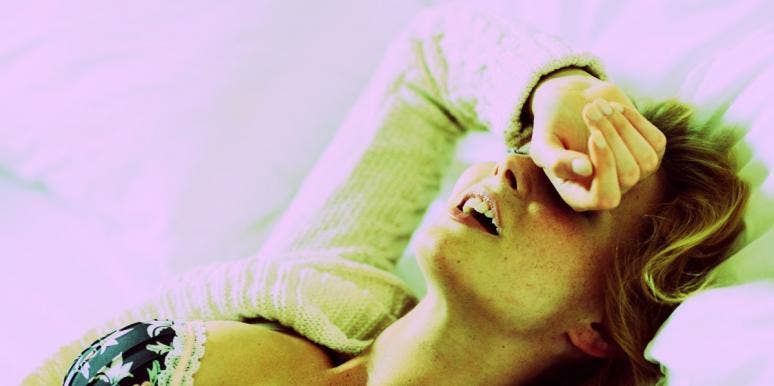 The Reason Men Like To Watch Women Masturbating woman lying down with her arm over her forehead