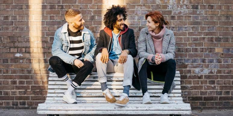 Why Guys Think You Like Them When You're Trying To Be Nice woman talking to two men