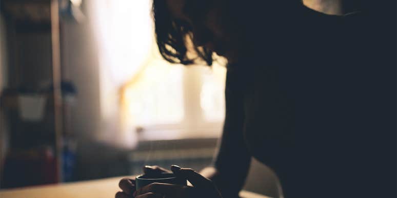 Why The Memories You Choose To Forget Are Actually Worth Remembering woman sitting in the dark with cup of coffee