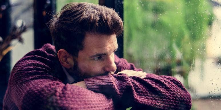 Why Men Give Silent Treatment After A Breakup & How To Deal With It man looking out a window giving silent treatment