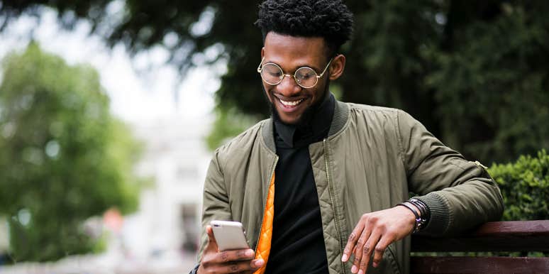 Why My Boyfriend Doesn’t Need Social Media For Us To Stay Connected man using phone