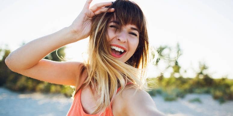 Why Constantly Searching For Happiness Is Making You Sad smiling woman