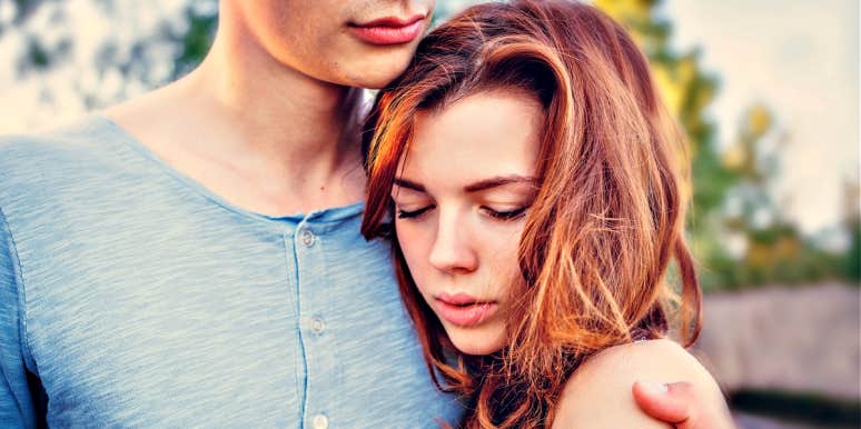 why women like emotionally unhealthy men woman sadly nestled into man's chest