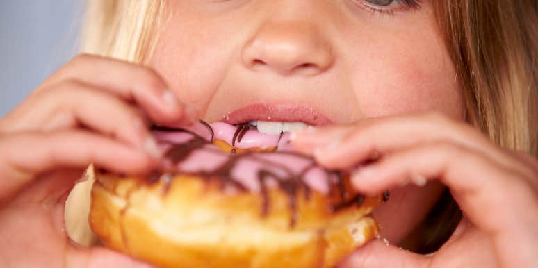 girl eating donut