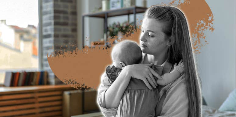 mom holding her daughter