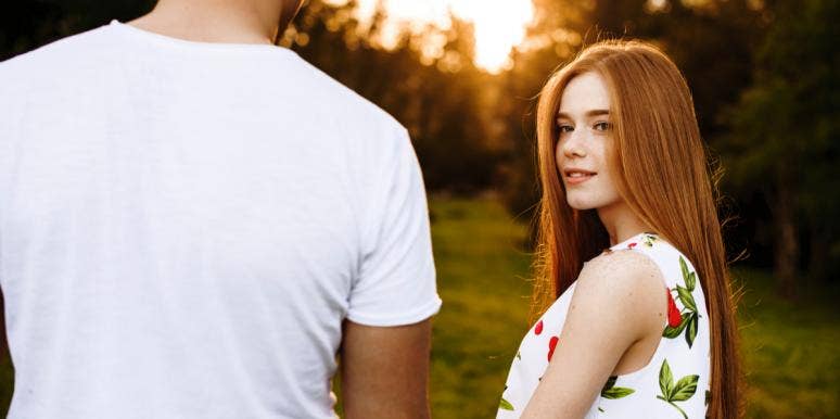 The Real Reason You Can't Seem To Meet The Right Person woman looking at man