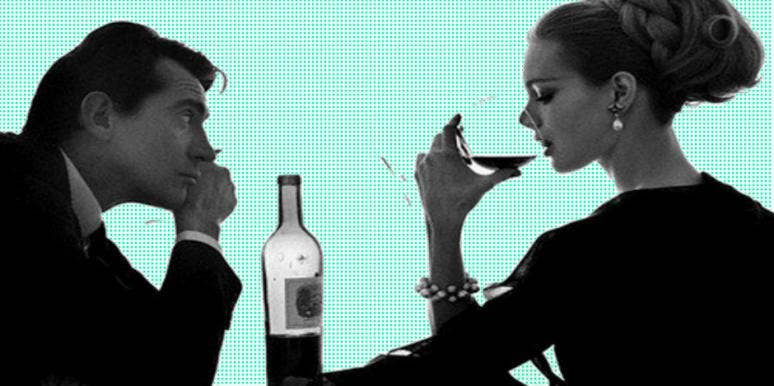 girl drinking wine with uninterested guy girl drinking wine with uninterested guy