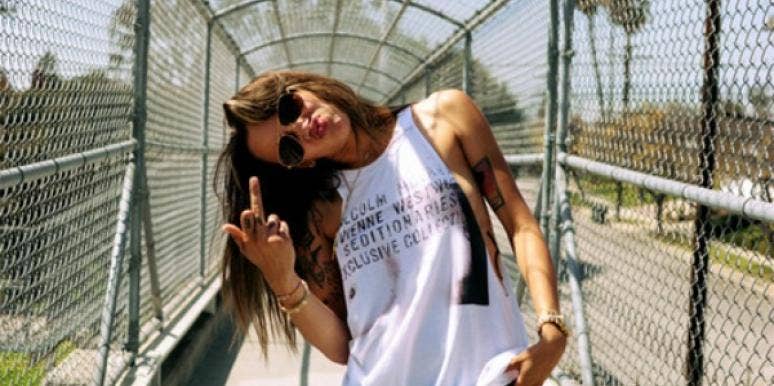 Woman flipping the bird. Woman flipping the bird.