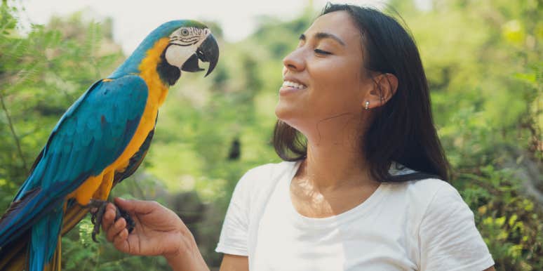 Woman Prioritizes Rescue Parrot Over Stepdaughter's Wedding Woman and a parrot