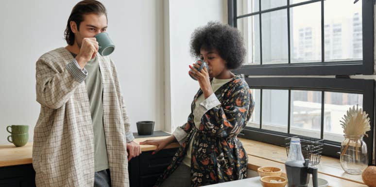 Man Refuses To Cut Off Female Coworker So Girlfriend Leaves Him Woman and man in kitchen