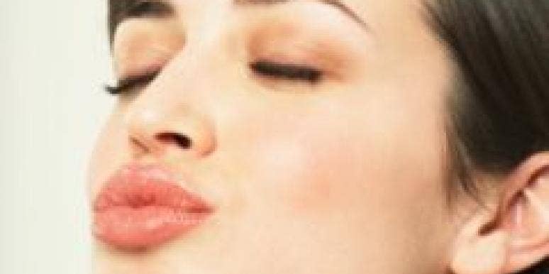 woman puckering up her lips for a kiss