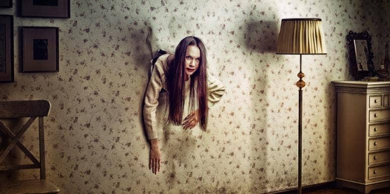 woman-coming-through-wall woman-coming-through-wall