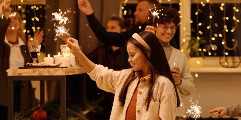 family holding sparklers at christmas 
