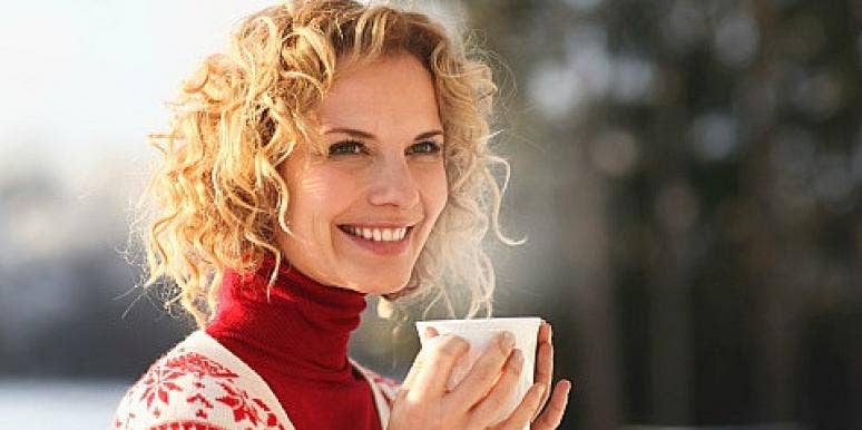 woman drinking coffee outside woman drinking coffee outside