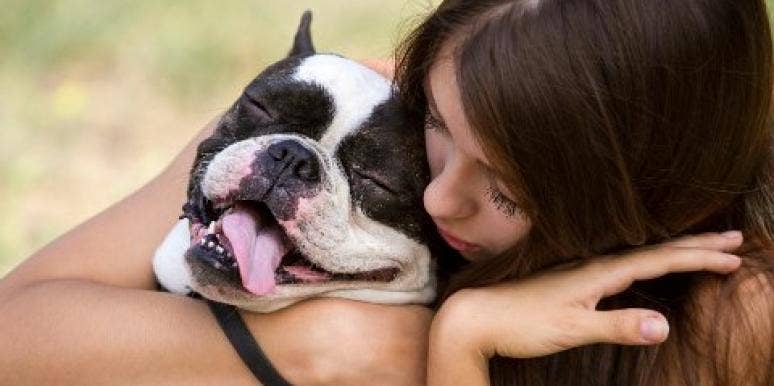 woman hugging a dog woman hugging a dog
