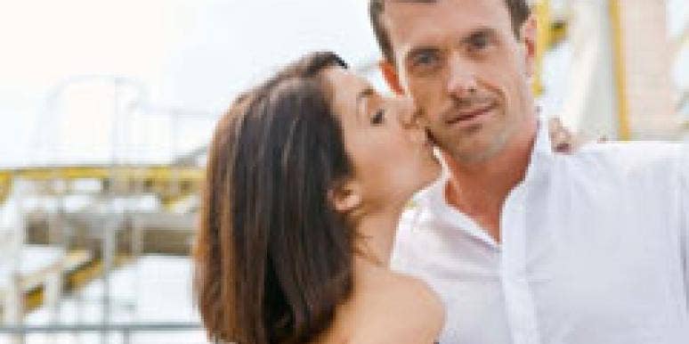 How To Avoid Moving Too Fast In A New Relationship woman kissing man on the cheek