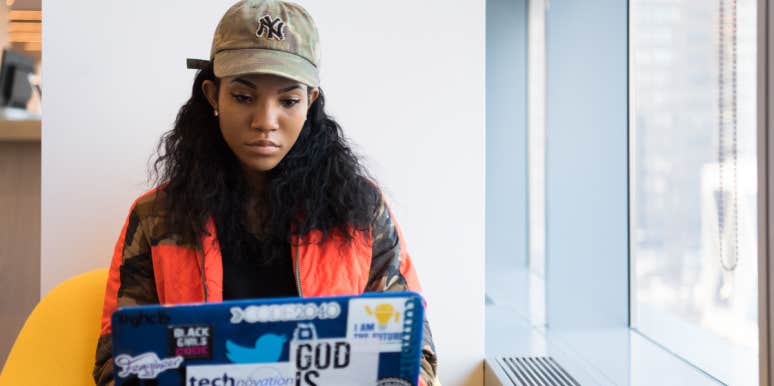 Woman's Boss Accused Her Of 'Quiet Quitting' Because She Only Works 40-Hour Weeks Woman on a laptop
