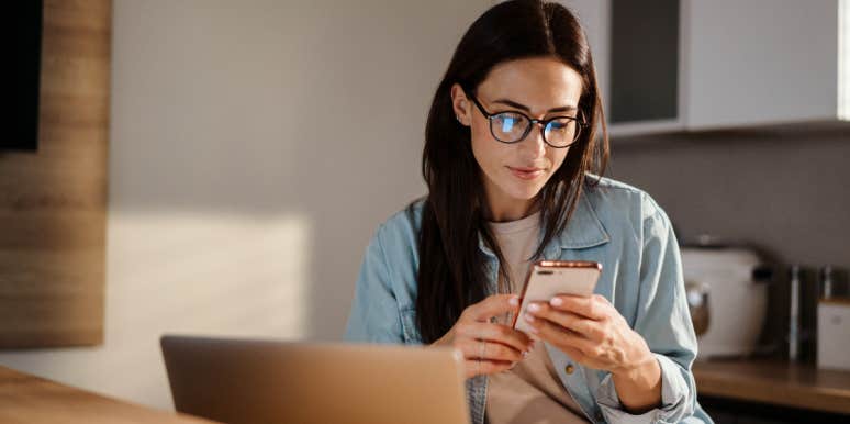Woman Believes Her Husband Is In Love With Her Boss Woman looking at phone